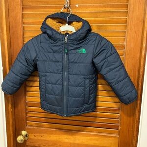The North Face Navy Puffer Jacket with Tan Sherpa Hood. Coat is reversible